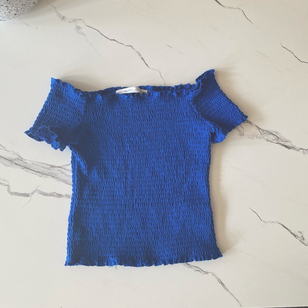Off the shoulder shirred top with ruffle trim